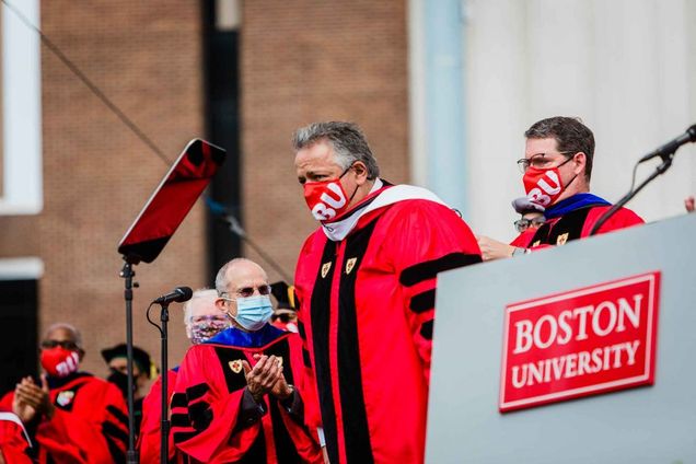 Noubar Afeyan, co-founder of Moderna, is adorned with an honorary stole while being awarded an honorary degree at Boston University's Commencement for advanced degrees.