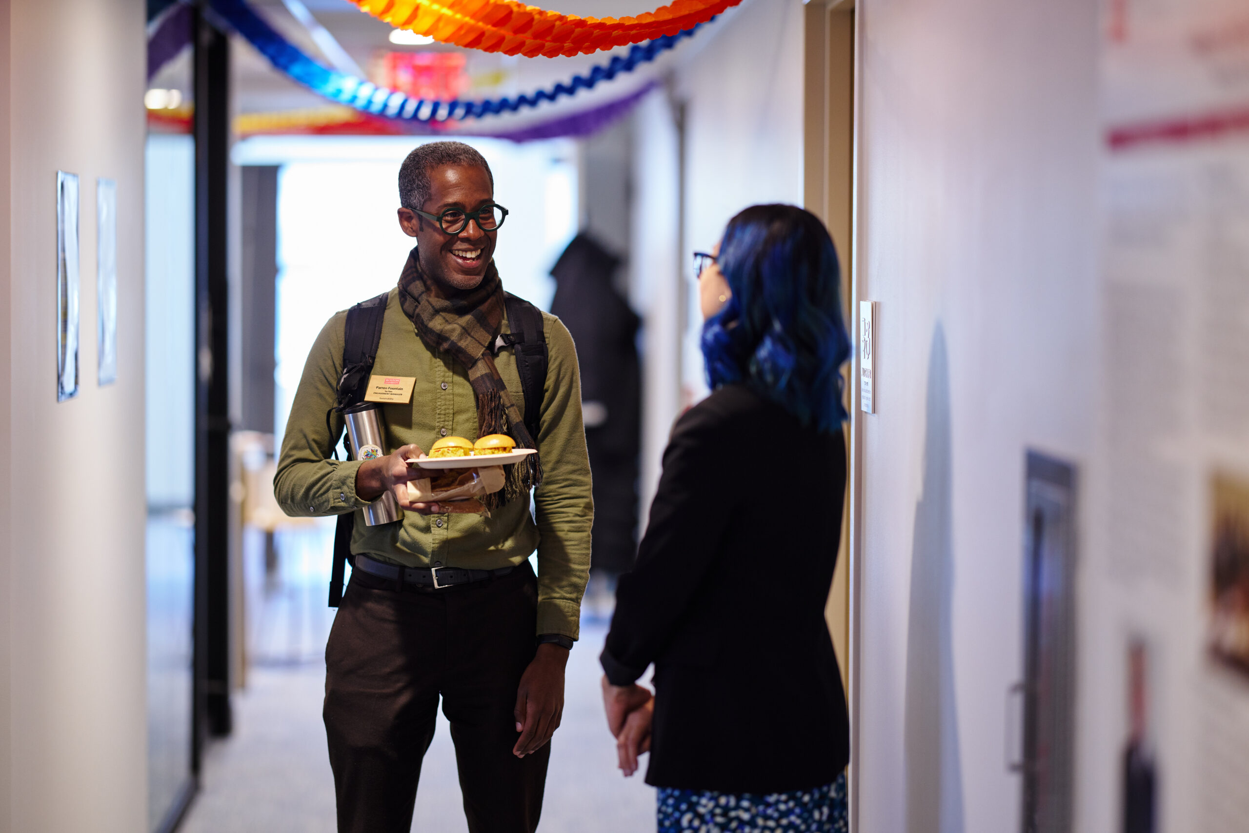 BU staff conversing during the grand opening of BU Diversity & Inclusion