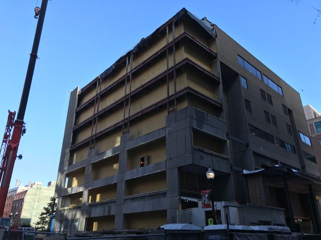 Removing the old precast concrete panels along the west elevation