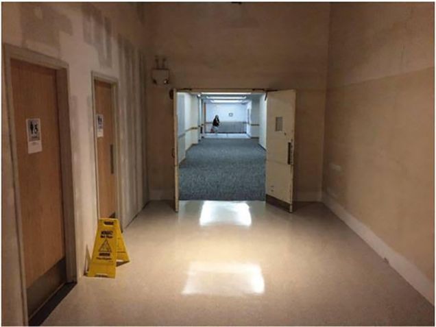 Flooring completed in Corridor 197 looking towards the west alley entrance by the concert hall.