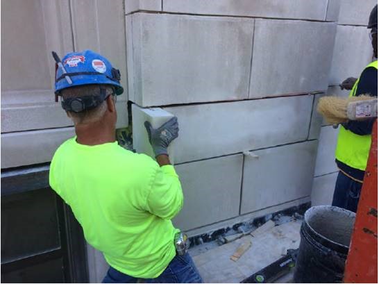 Setting of new stone at the West Elevation