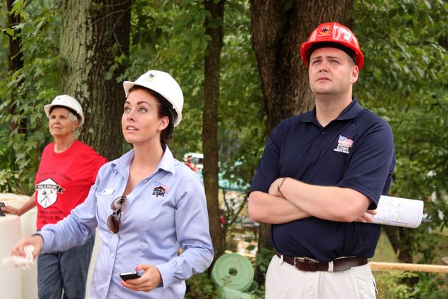Andrew Rovan and two others on a Homes for Our Troops construction site