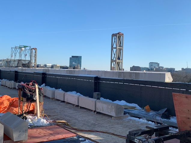 Capstone being set on the south façade