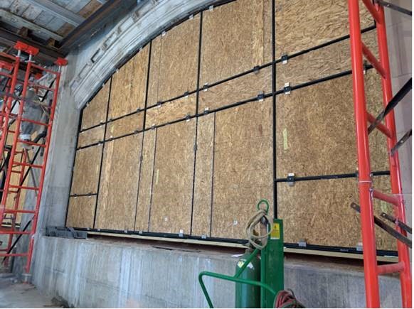 Glass openings boarded to allow interior classroom work to continue
