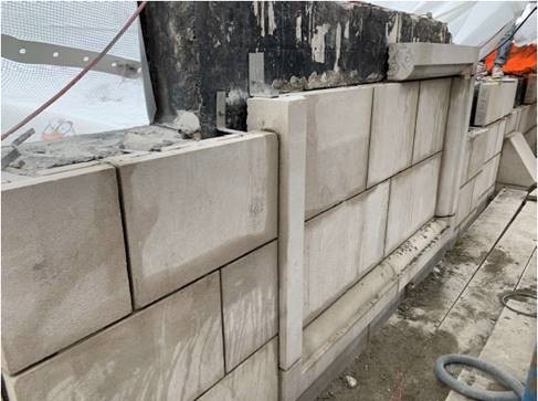 Stone on the west façade parapet being set
