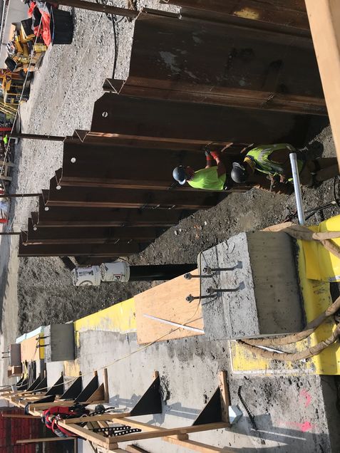 Removing the top of the Support of Excavation (SOE) sheets prior to backfill