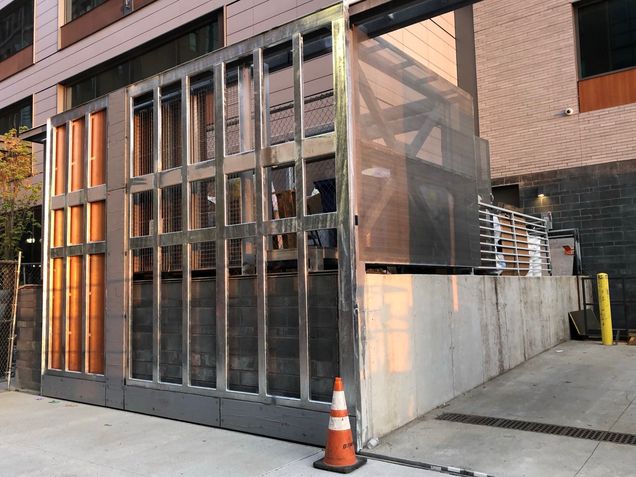 New rolling gate and decorative panels installed at the loading dock on Albany Street