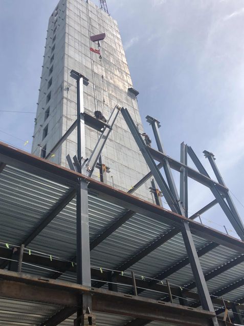 Bolting steel cross beam into place