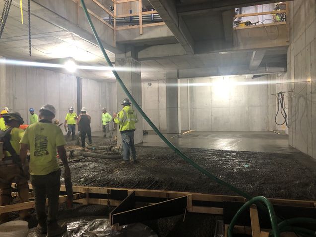 Placing 300 cubic yards of concrete for the topping slab in the tower’s subbasement