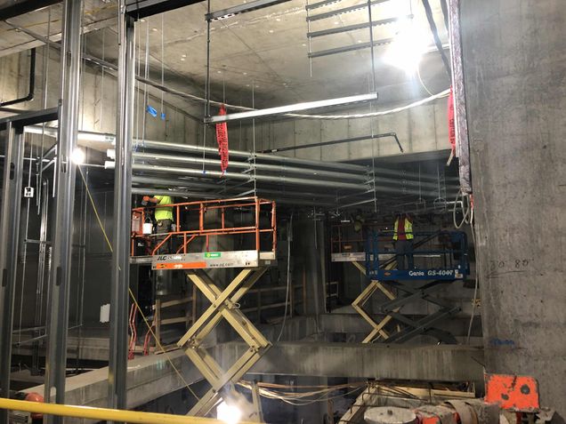 Installing electrical conduits to the main electrical room in the tower's lower level