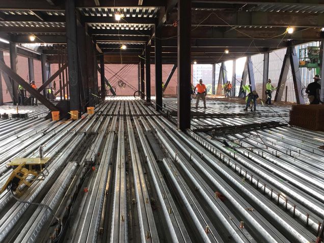 Installing rebar on the podium's 4th floor in advance of the concrete placement