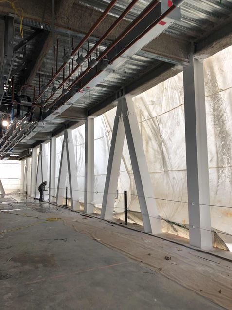 Applying intumescent coating to the towers 4th floor steel