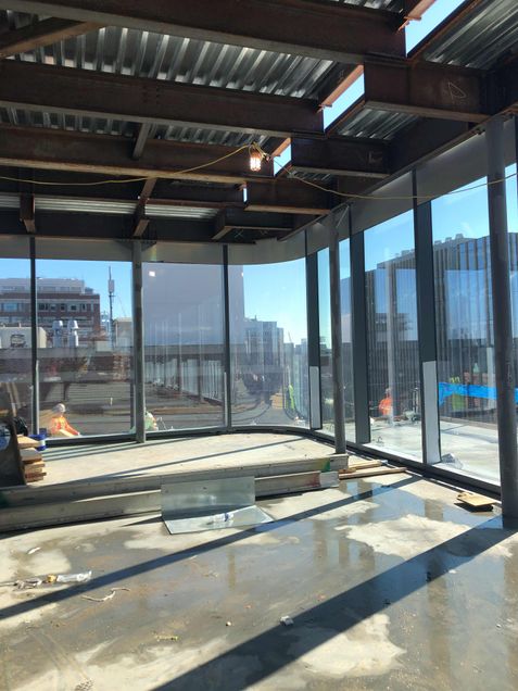 Installed curtain wall panels on the podiums 5th floor