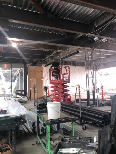 Installing plumbing lines on the podium's 5th floor