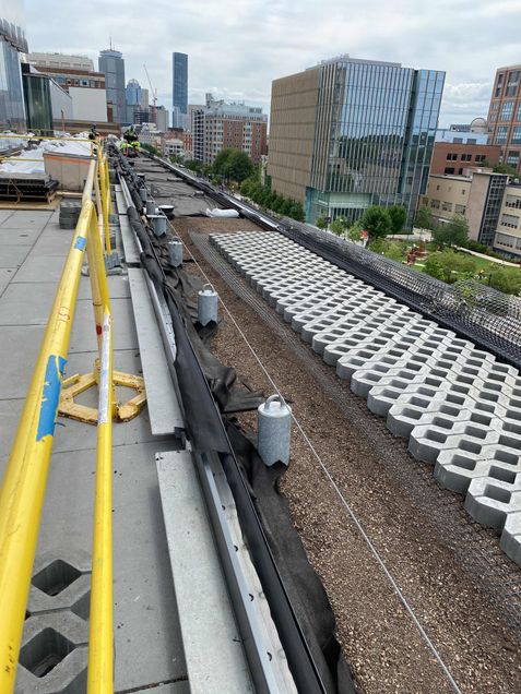 Installing green roof material on the 5th floor terrace