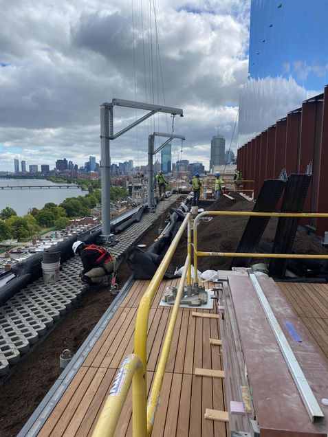 Installation of green roof material on the 10th floor terrace