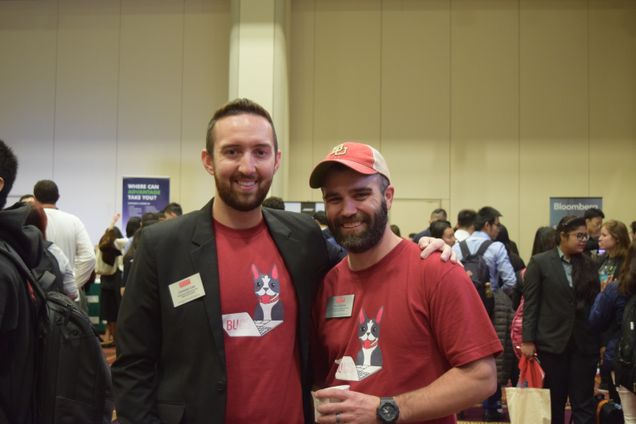 BUCS staff members Christian Cole (CAS'11) and Chris Devits model the CS Day 2019 t-shirt. 