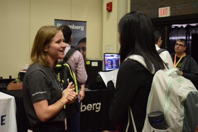 A student meets with a Bloomberg employee to discuss career opportunities. 