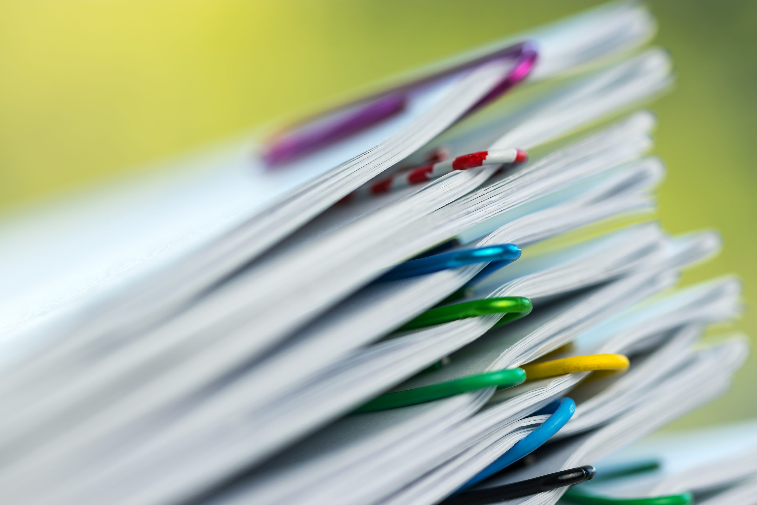 Multiple stacks of paper grouped with paper clips