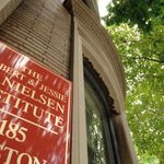 Danielsen Institute looking up at sign and building.
