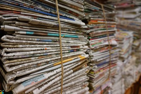 Newspaper stacks bundled together