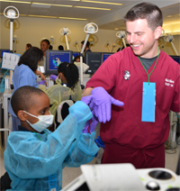 Matt Mara DMD 16 and Brooke School student Latrell Mumford practice “flossing” Matt Mara DMD 16 and Brooke School student Latrell Mumford practice “flossing”