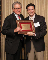 Dr. Michael Goldstein (right) presents the Holyoke Award to Steven Perlman PEDO 76