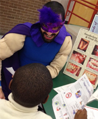 Captain Cavity Fighter with a child