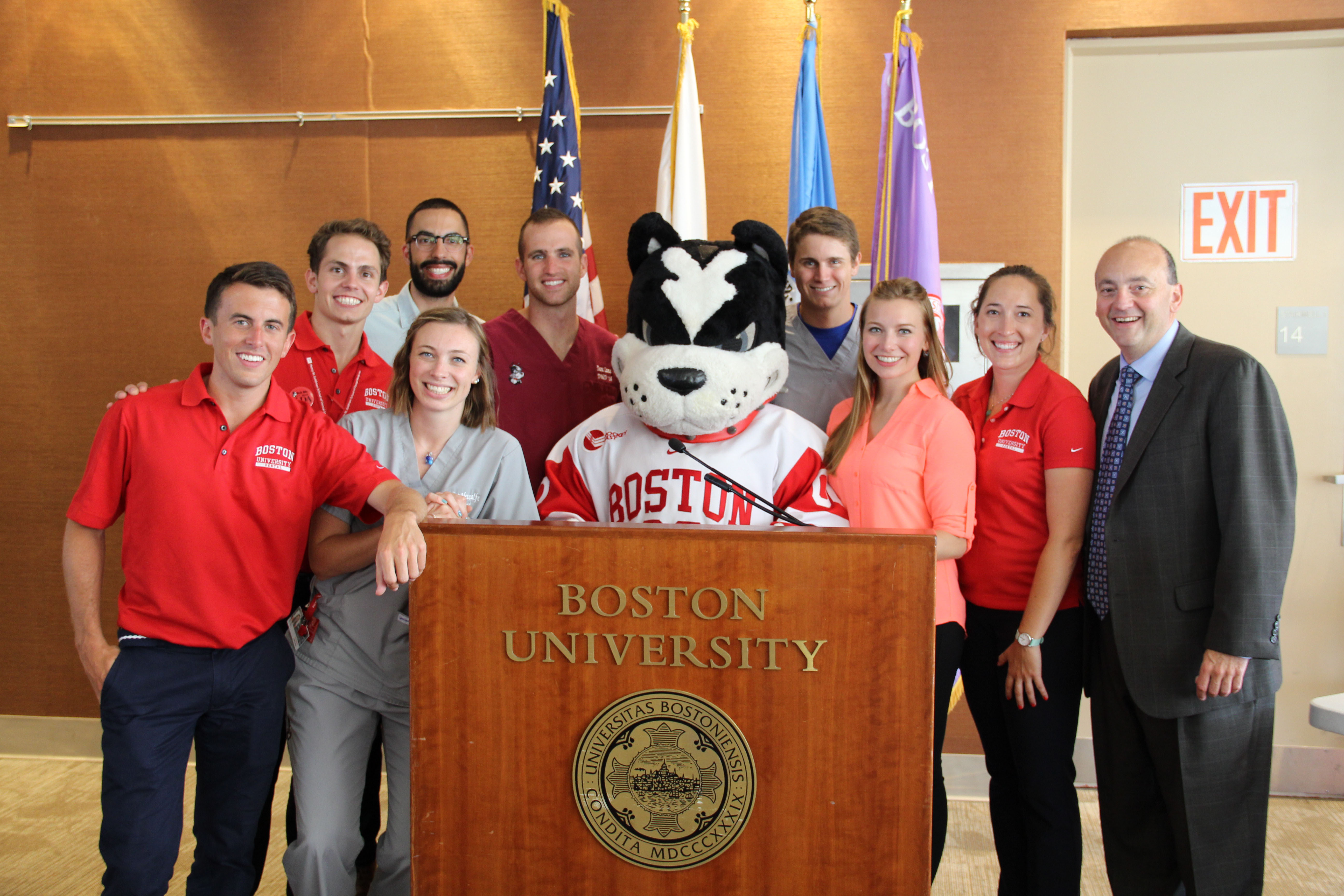 Rhett poses with Dr. Joseph Calabrese (r) and students