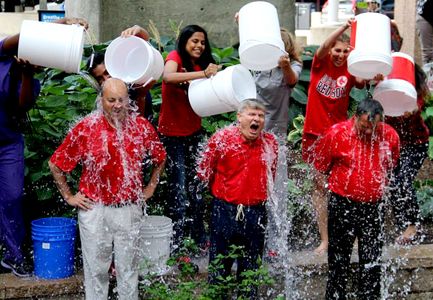 (l-r) Dr. Calabrese, Dean Hutter, and Dr. Guarente get doused during the Ice Bucket Challenge