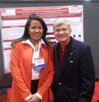 Dr. Annetty Soto and Dean Jeffrey W. Hutter with the award-winning poster