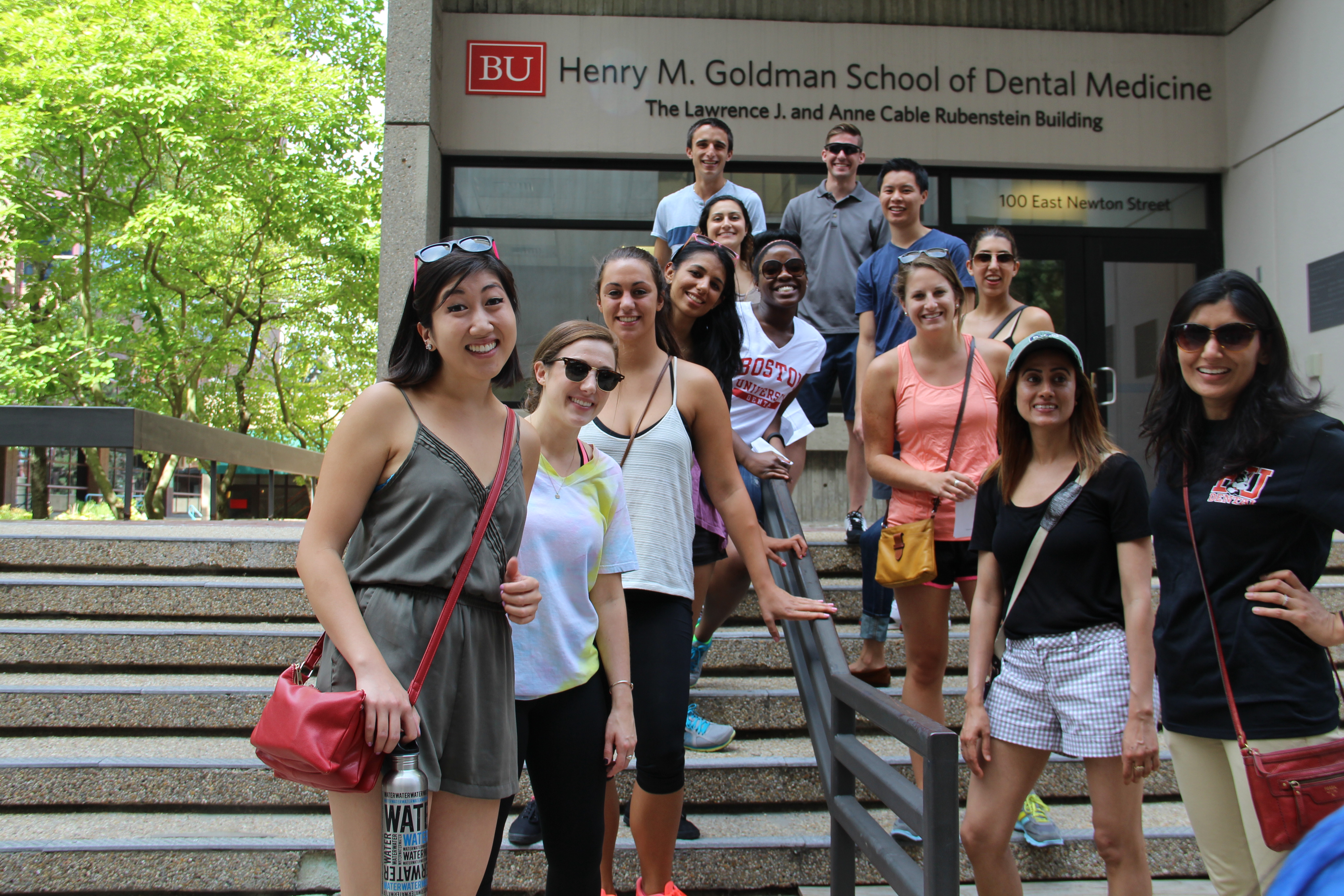 New students pose on the steps of 100 East Newton Street