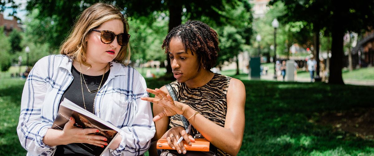 Two women having a discussion in the park