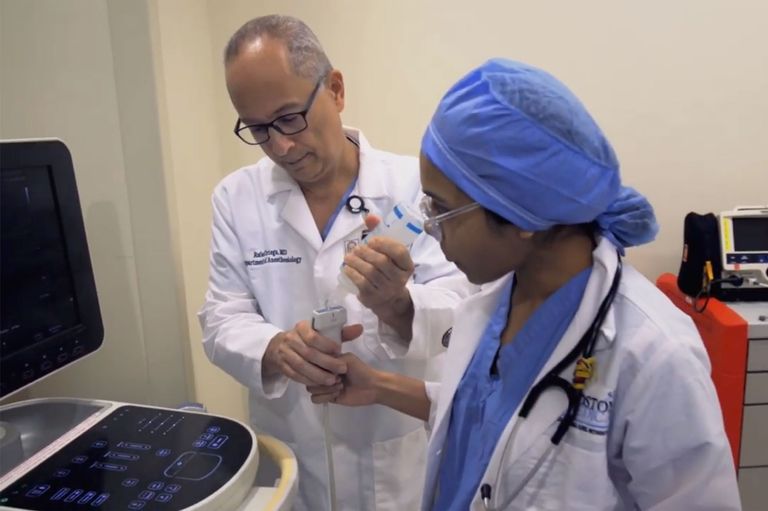 Raphael Ortega teaching a medical student