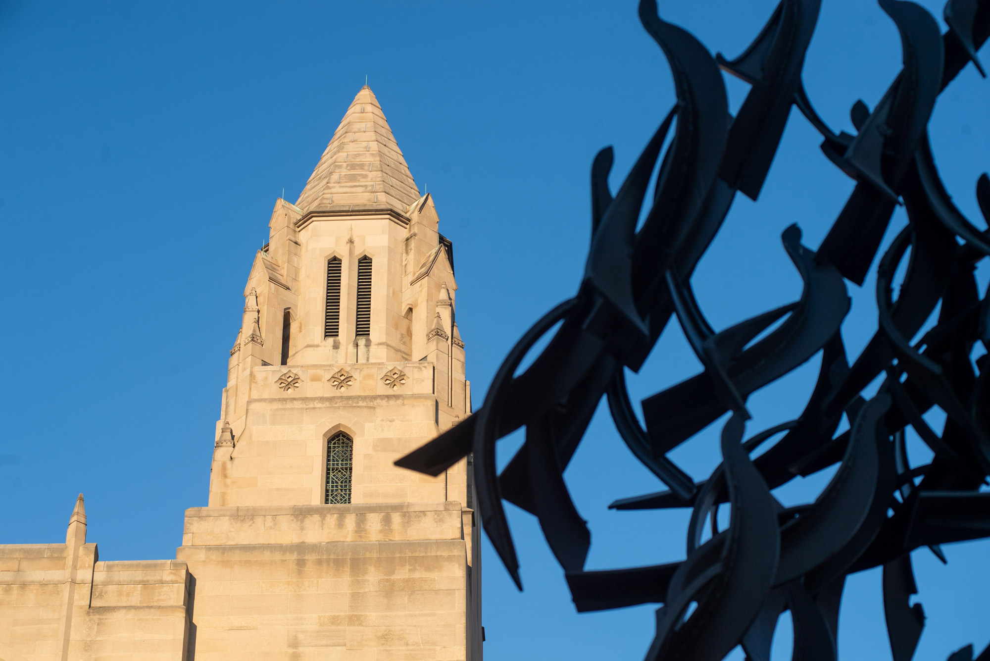 Building and sculpture with blue skies
