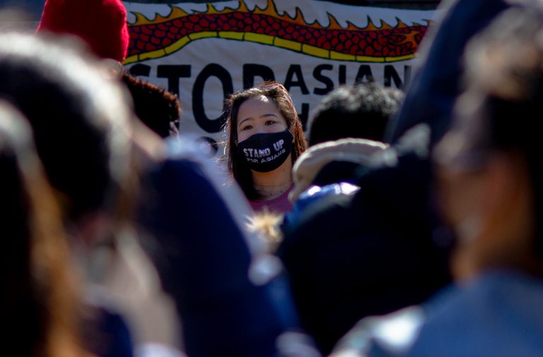 Woman wearing face mask during protest