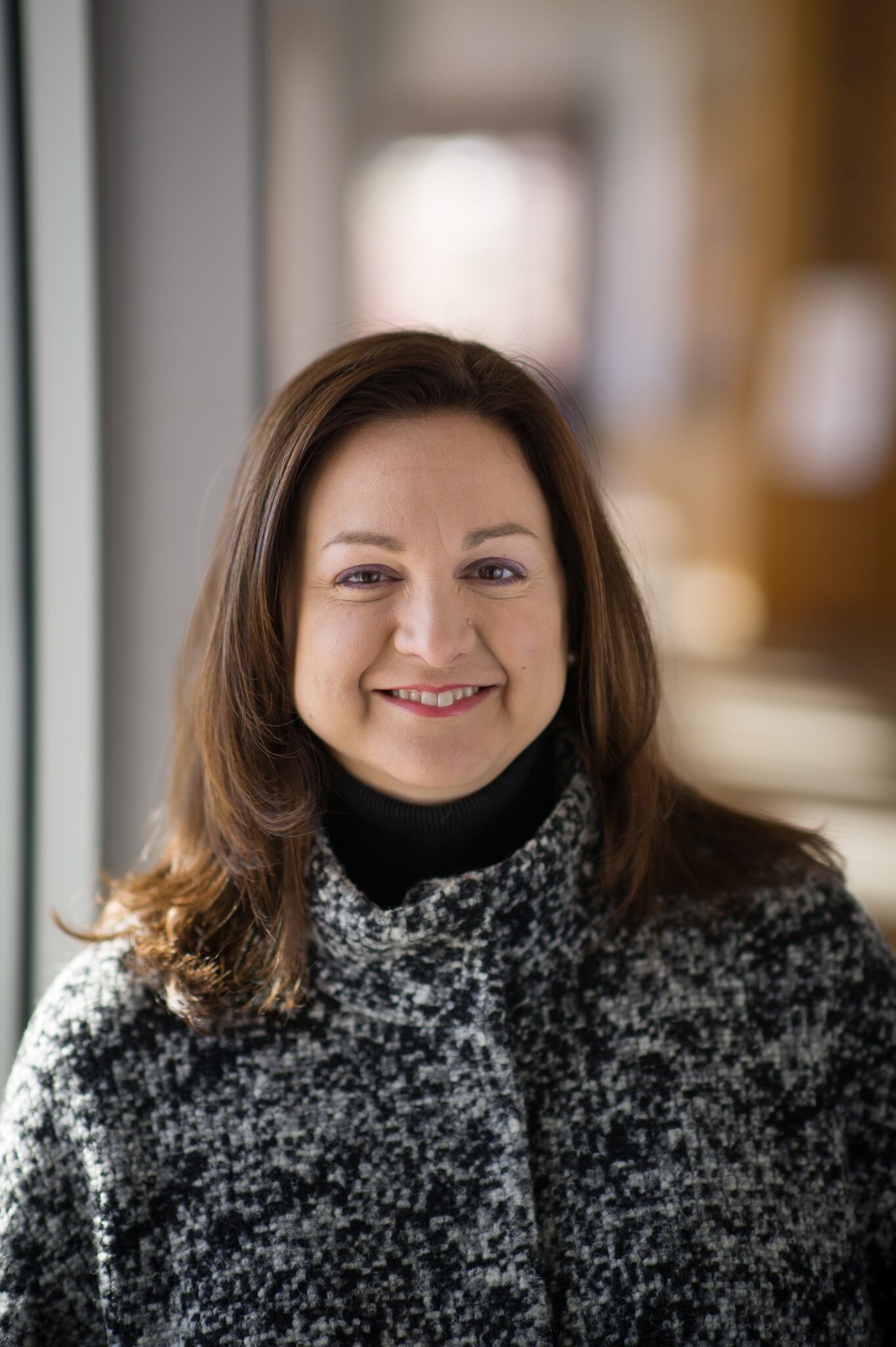 Headshot photo of Debbie Bazarsky wearing gray sweater