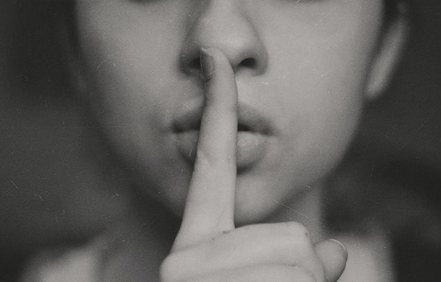Image of person using the quite motion with a finger held at their mouth