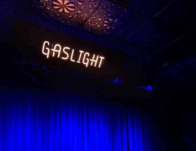 Neon letters displaying Gaslight with black and blue background
