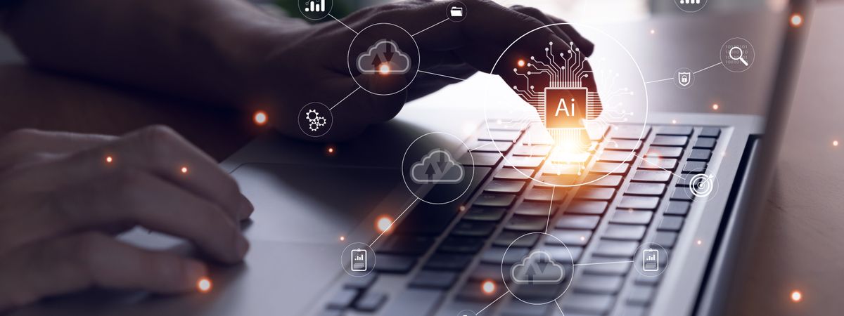 Selective focus at men hand that typing on keyboard to enter command for AI that can access to cloud computing unit that can access to business and customer database to create marketing campaign.