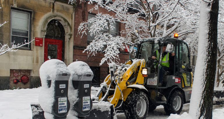 BU Facilities worker removes snow on Bay State Road