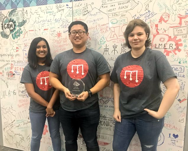 The BostonU Hardware Team (from left to right), Dinithi Samarasekera (BME ’20), Dylan Samperi (BME, CE ’19), and Sarah Nemsick (BME ’20), display their award for Best Hardware Project at the iGEM Jamboree.