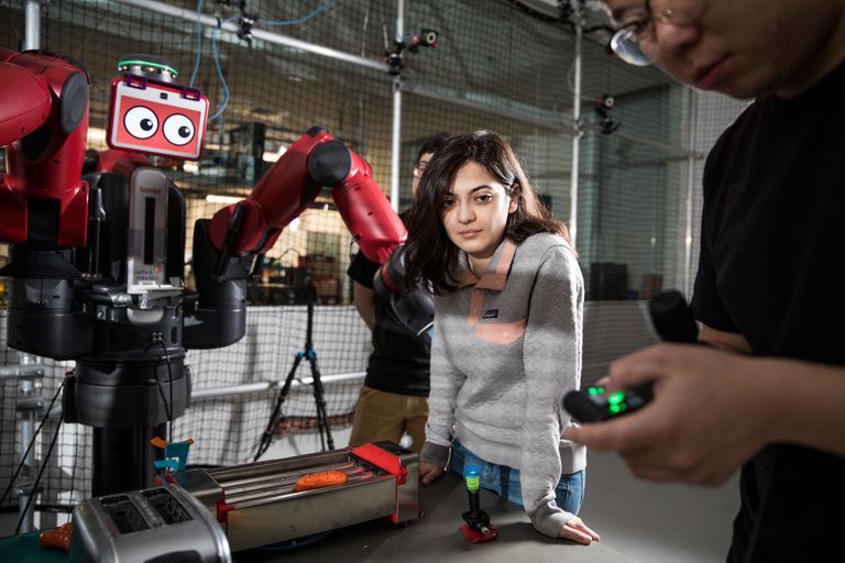 picture of a student in the robotics lab working on a robot