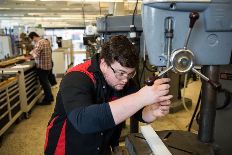 Student working with machinery in an Engineering lab