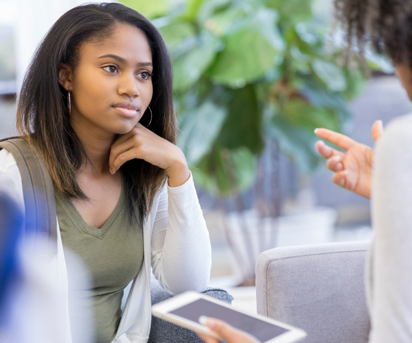 An attentive students meets with an advisor