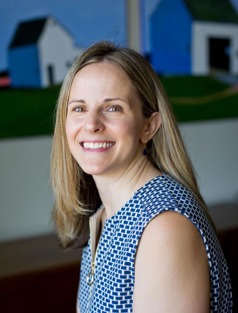 Portrait of Judy Platt, director of Student Health Services, in a blue and white shirt.