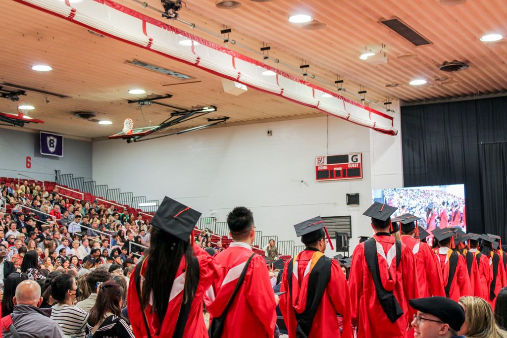 Master's graduands walking to their seats