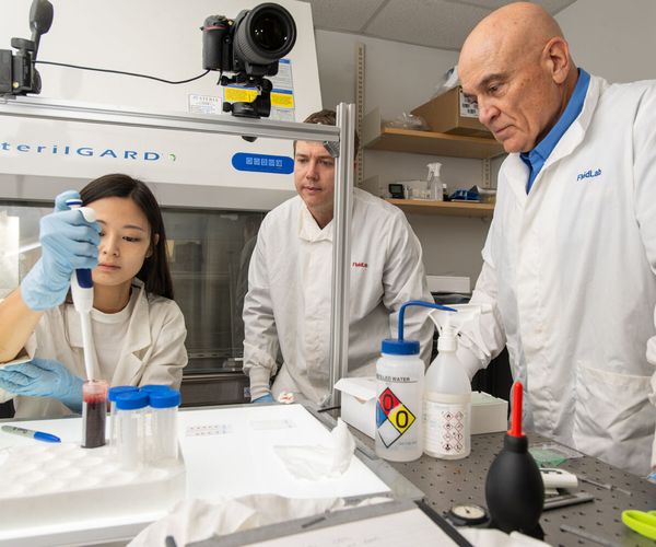 Prof. Bird in lab studying blood stain patterns