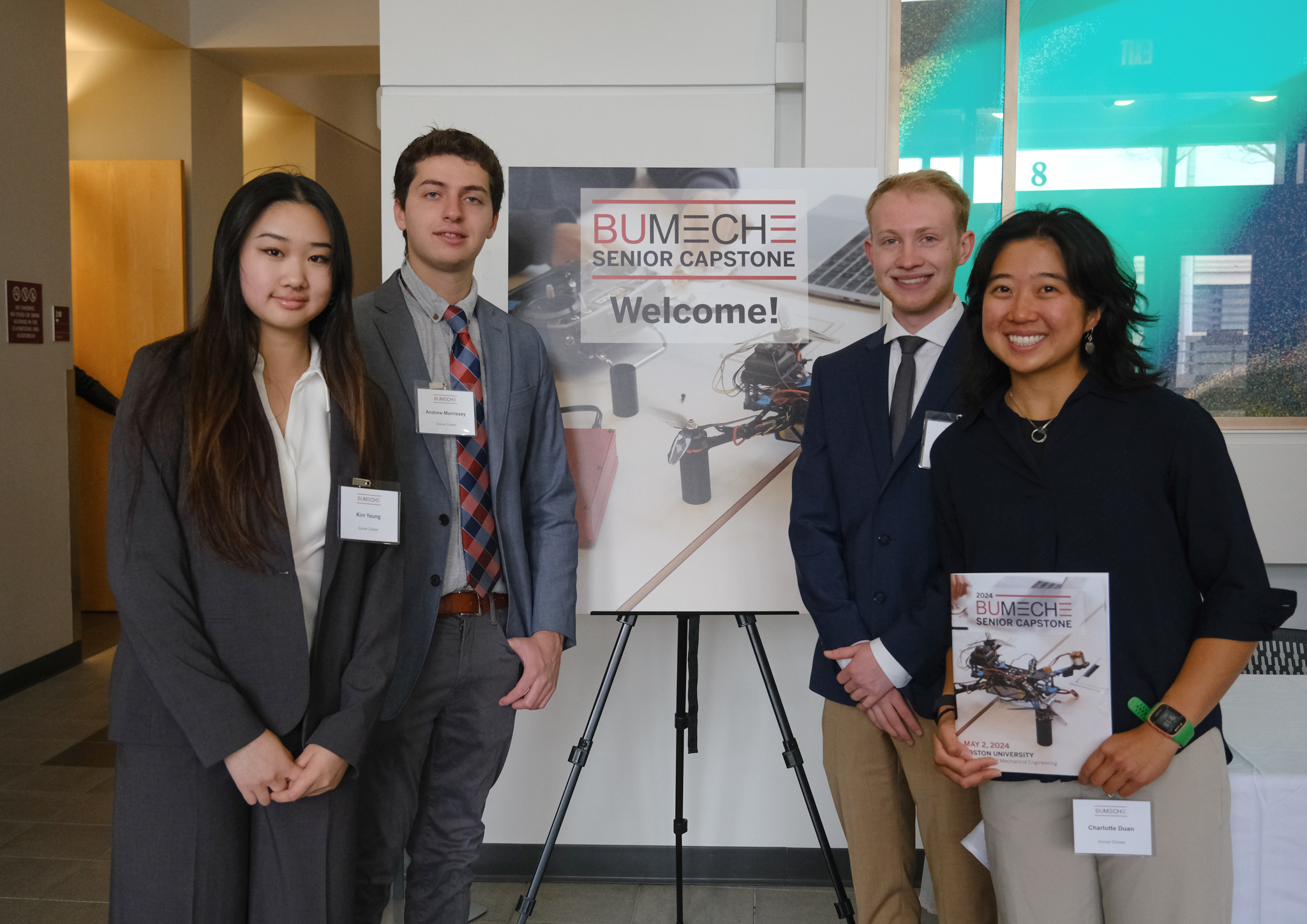 Students posing in front of their project