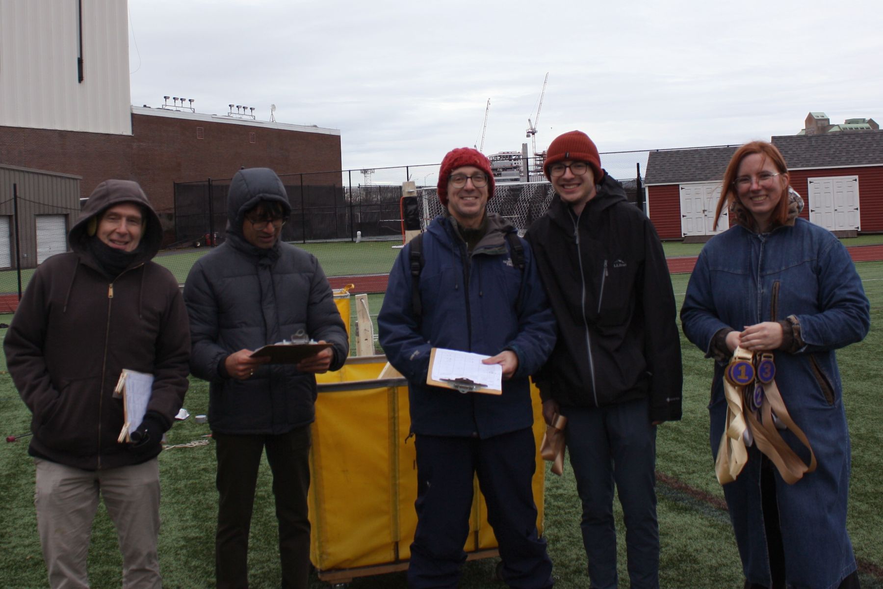 3 judges, the 3rd place student, and K in a line for the picture